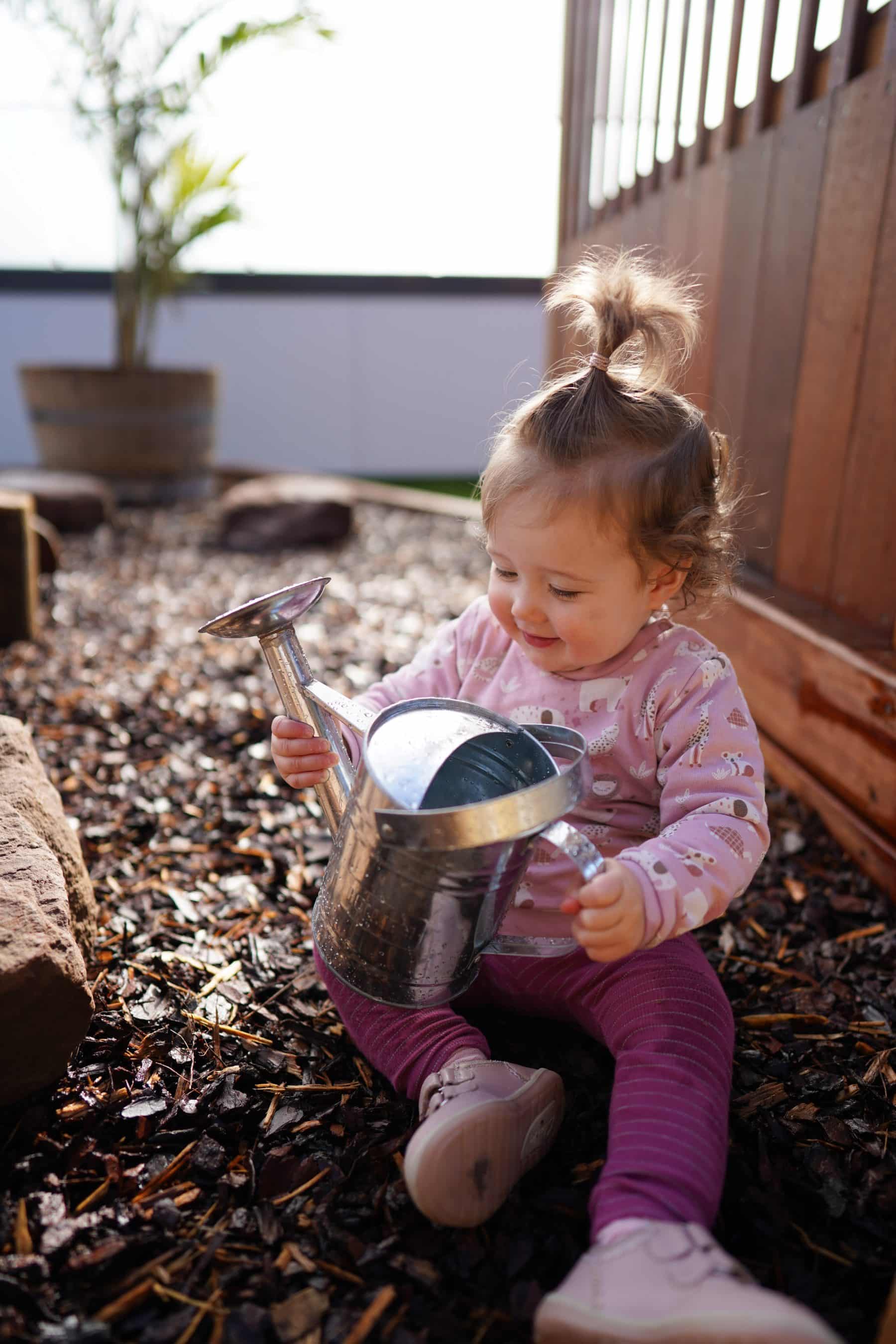 Child with watering can